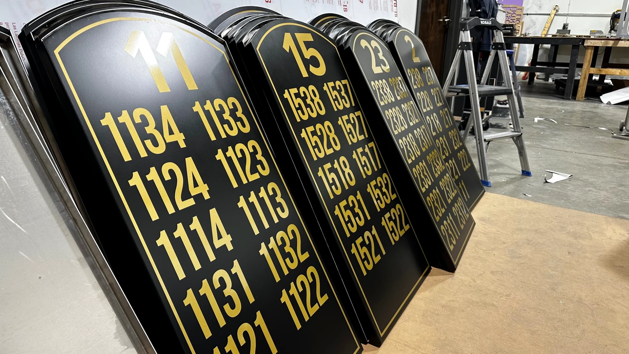 Black and gold custom architectural wayfinding signage